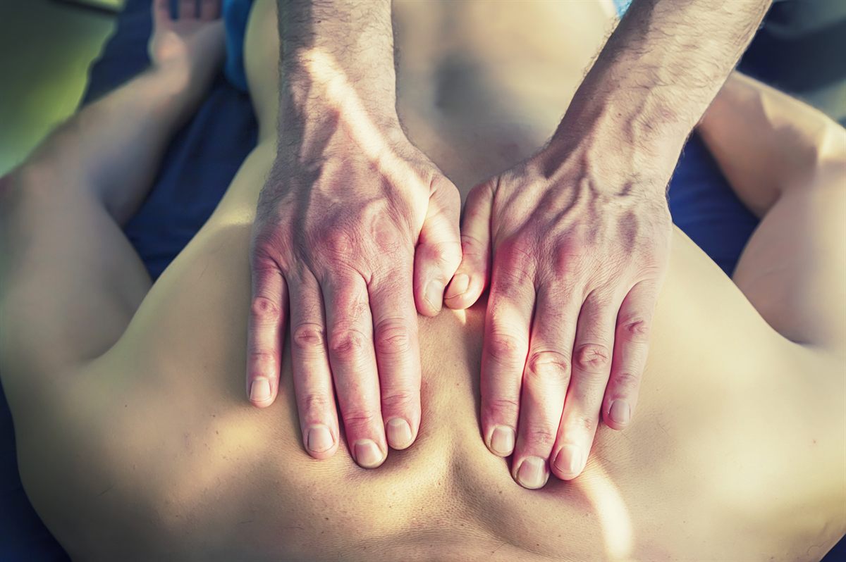 Yann giving a deep tissue back massage at French Studio